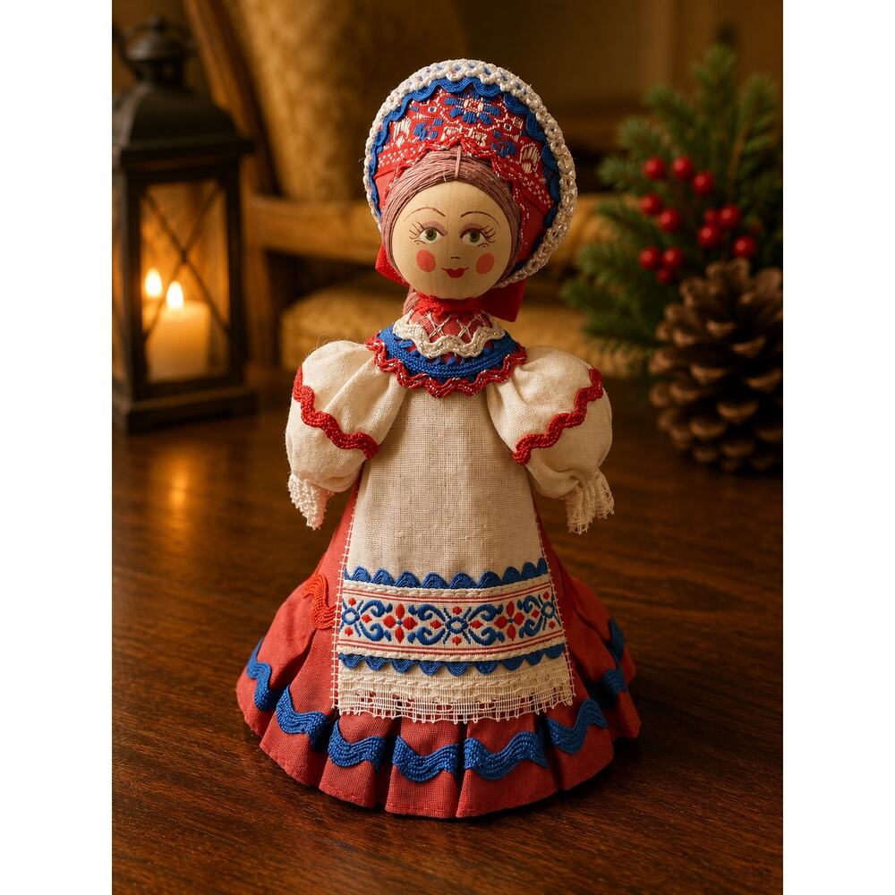 Russian cloth doll is handmade with traditional embroidery on its dress